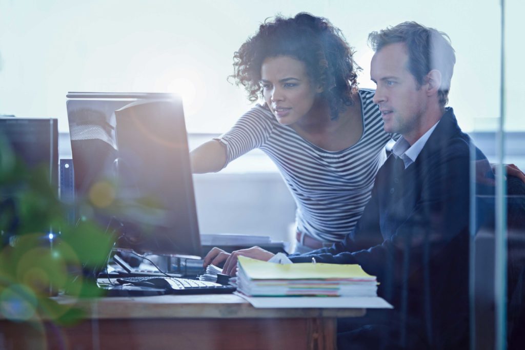 two people looking at shared computer screen