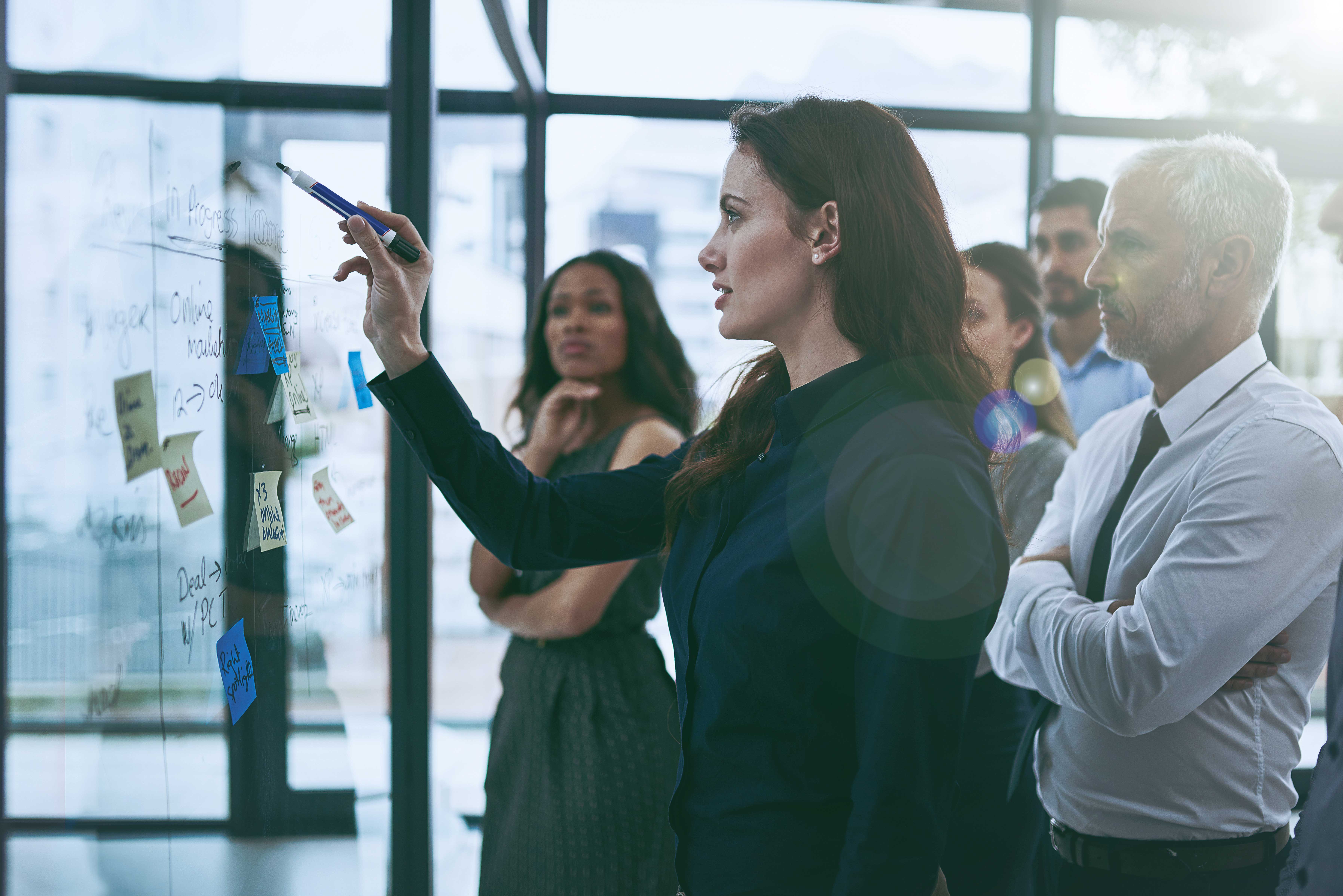 Accounts Payable Automation - Shot of a group of colleagues having a meeting in a modern office