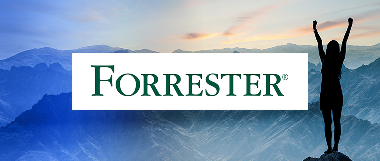 forrester logo overlaid silhouette of business woman celebrating on top of a mountain